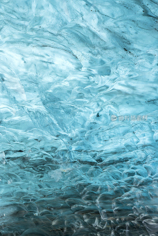 beautiful blue ice wall in an ice cave of the Vatnajökull glacier in Iceland